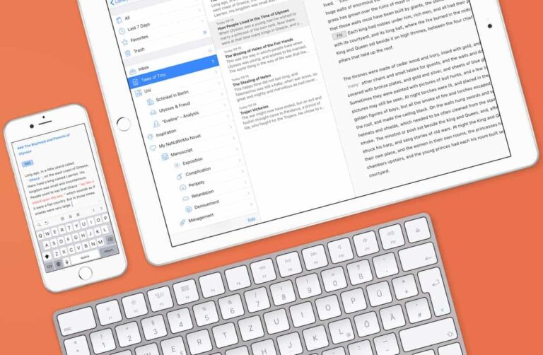 Tablet, smartphone and keyboard on orange background