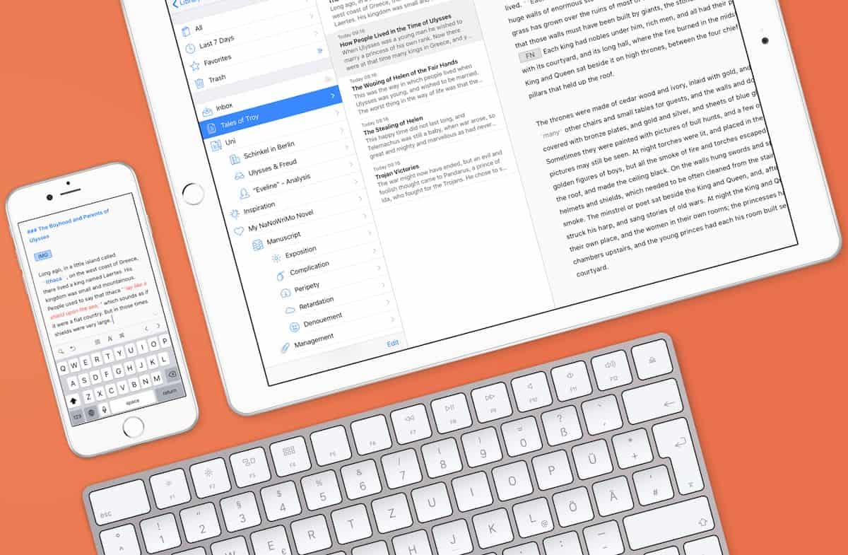 Tablet, smartphone and keyboard on orange background