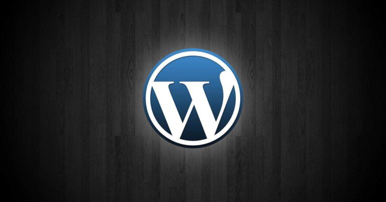 WordPress logo on dark wooden background