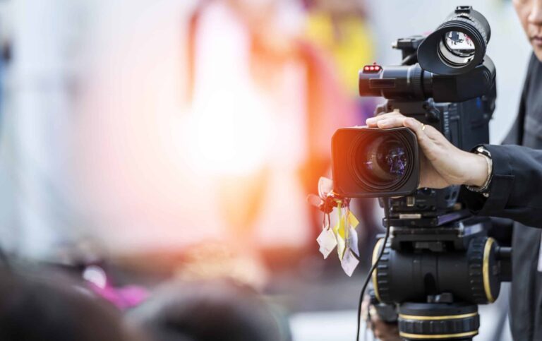 Professional video camera filming at live event