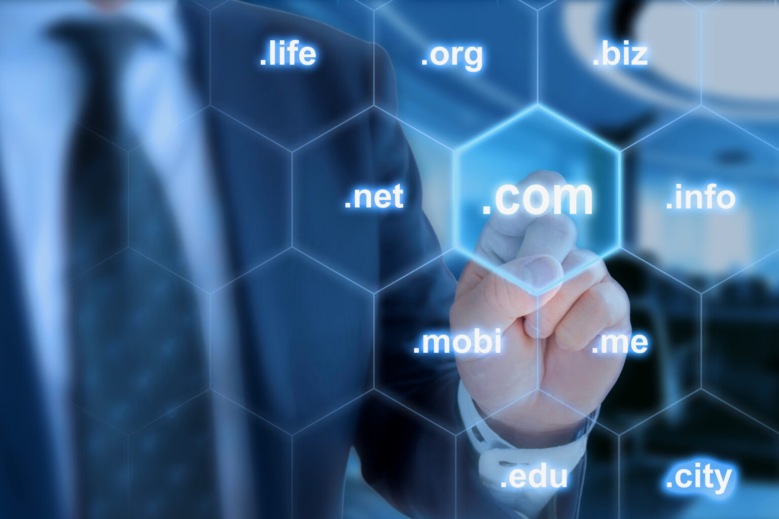 Businessman selecting .com domain on virtual screen