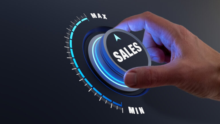 Hand turning sales dial towards maximum level