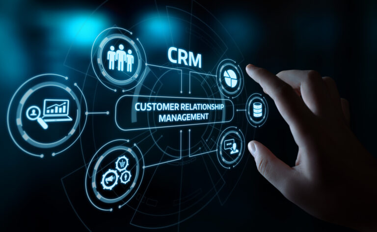 Hand interacting with digital CRM interface display