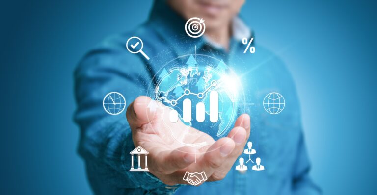 Hand holding digital globe with financial growth icons
