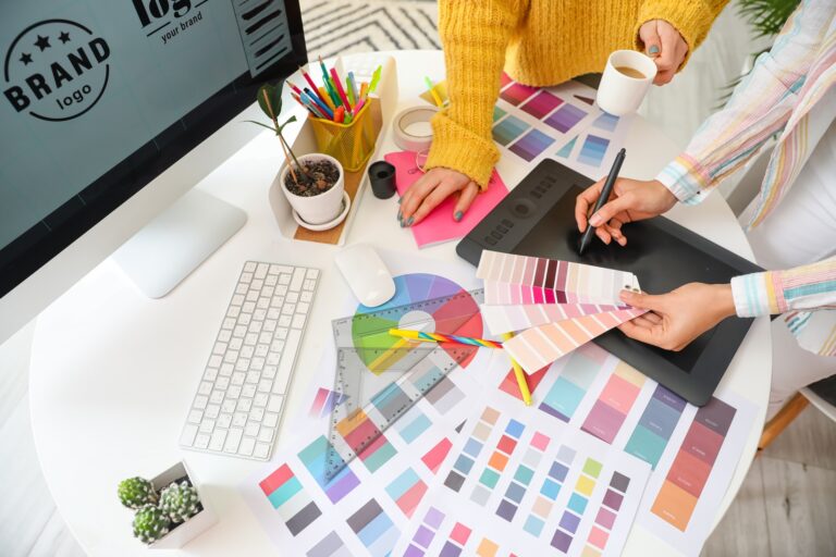 Graphic designers collaborating on brand color selection