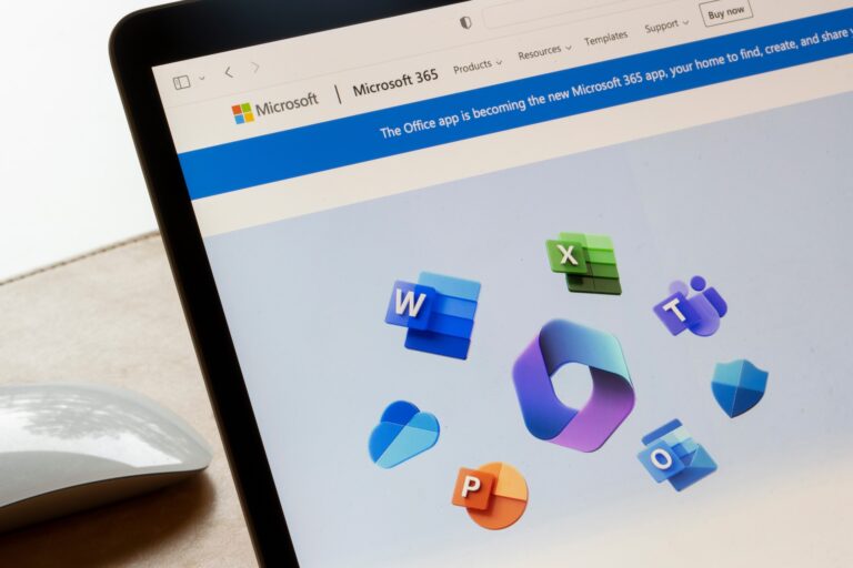 Laptop displaying Microsoft 365 app icons on screen