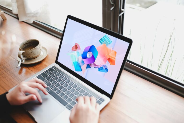 Person using laptop with Microsoft 365 on screen