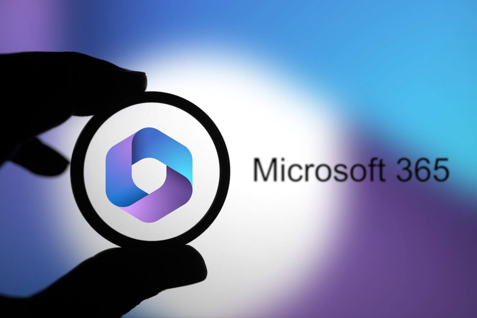 Magnifying glass over Microsoft 365 logo