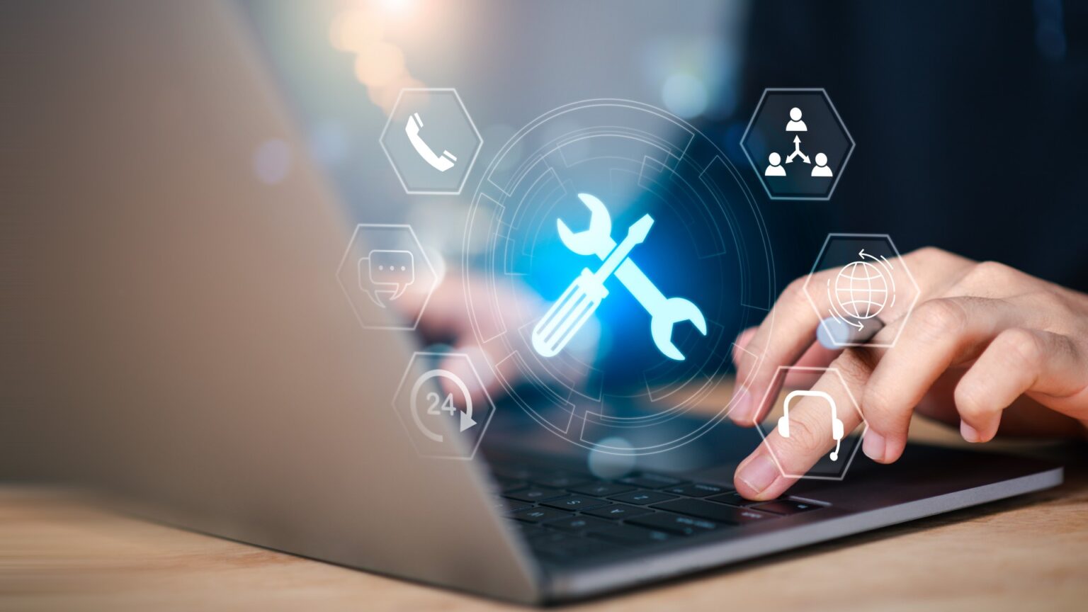 Hand using laptop with virtual technical support icons