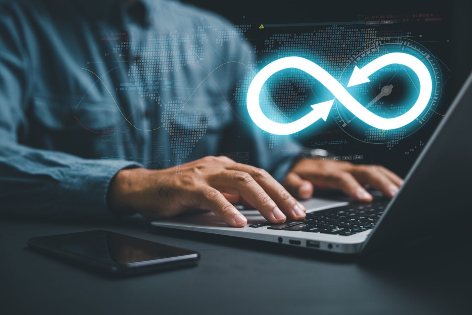Person typing on laptop with digital infinity symbol
